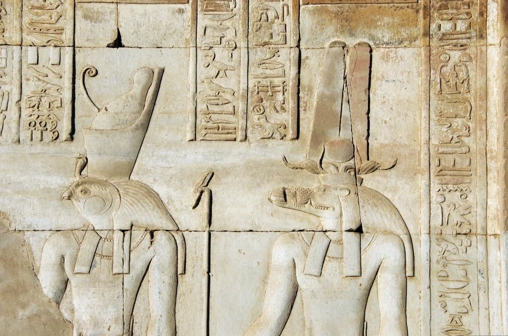 Ancient hieroglyphic reliefs and wall carvings inside the Temple of Kom Ombo tour