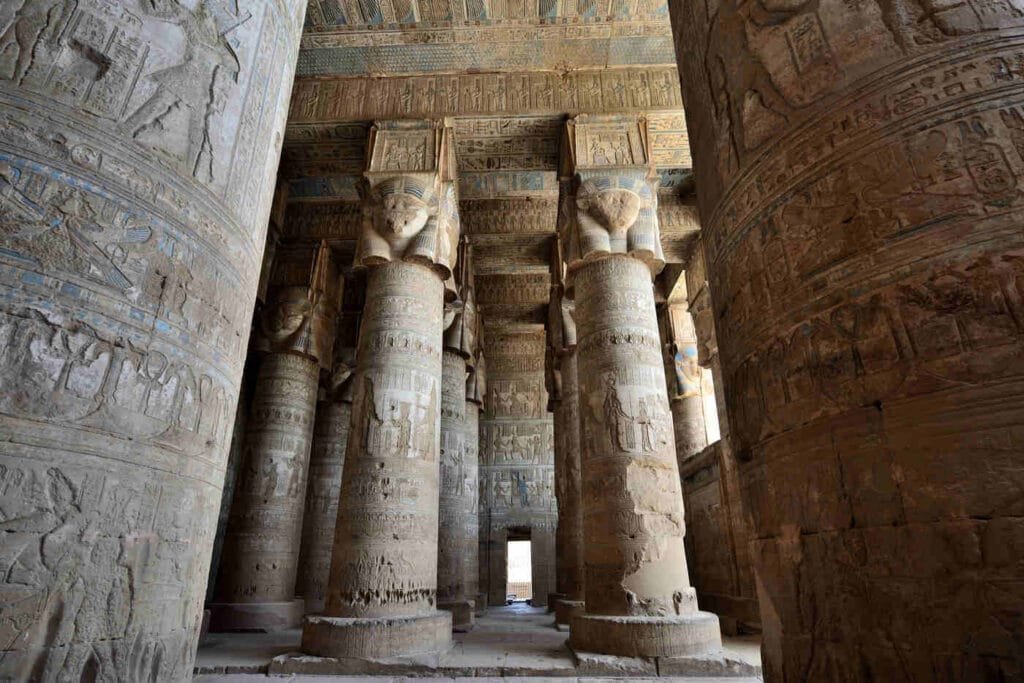 Hathor-headed columns in the hypostyle hall of the Temple of Hathor at Dendera, where astronomical scenes decorate the ceilings