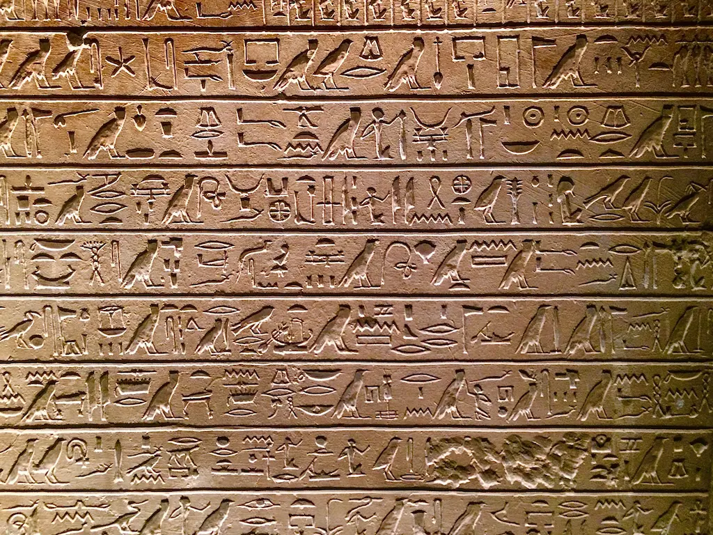 Hieroglyphic inscriptions carved in temple stone — ancient Egypt's system of mass communication and public opinion