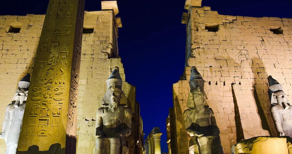 Luxor Temple illuminated at night — the beating heart of social life of ancient Egypt