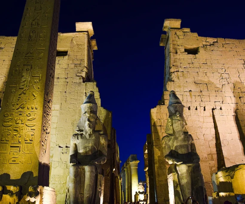 Luxor Temple illuminated at night — the beating heart of social life of ancient Egypt