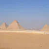 Panoramic view of the three Giza Pyramids under a clear sky - Egypt sightseeing tours in Cairo