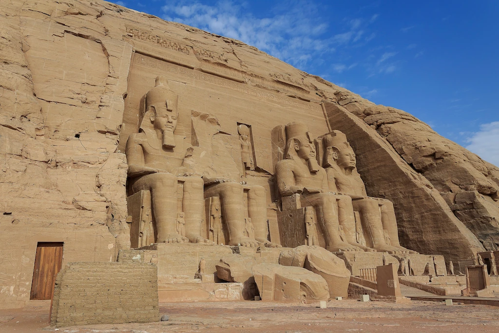 Upper Egypt Travel Guide - The grand facade of Abu Simbel Temple with its four seated colossi of Ramses II
