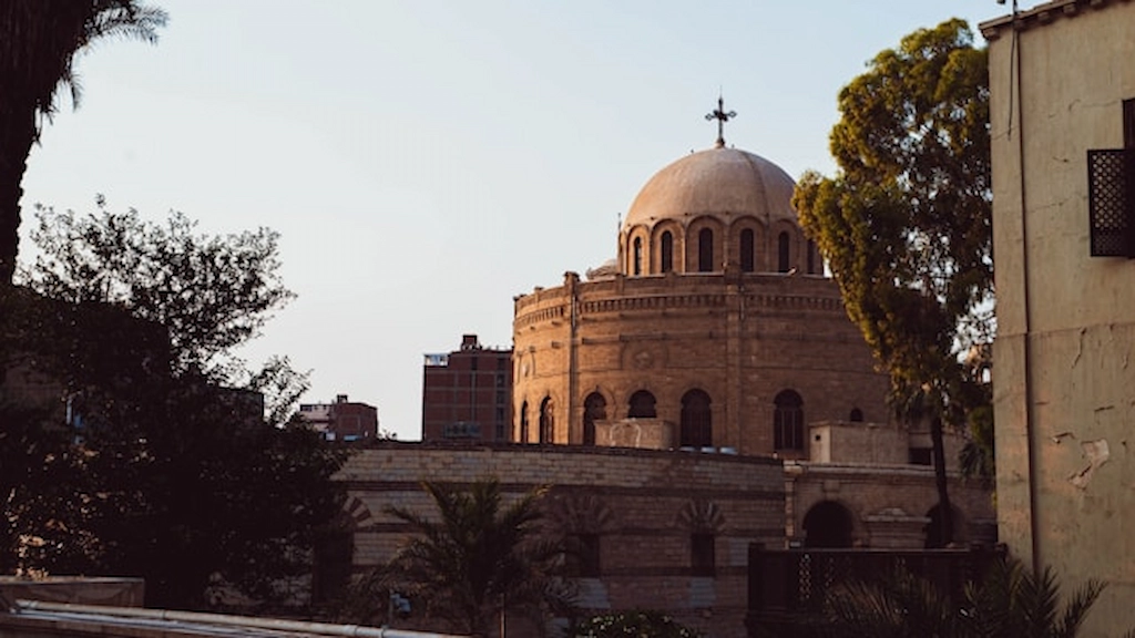 Coptic Cairo Egypt church architecture with gothic arches and palm trees