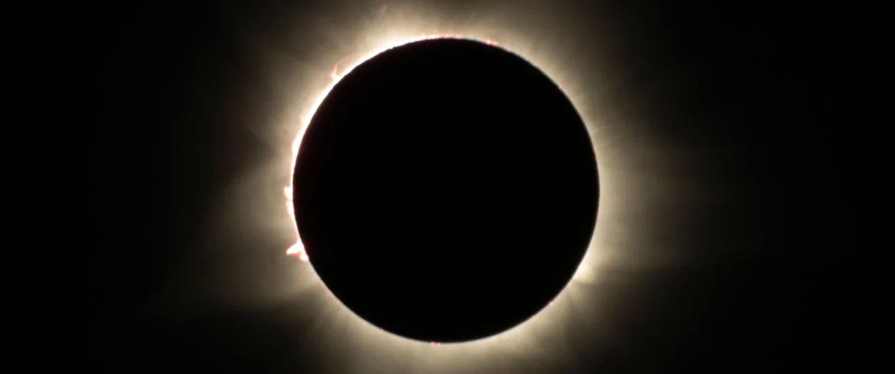 Total solar eclipse corona glowing around the darkened sun, the sight travelers seek on an Egypt Solar Eclipse Tour- Egypt Solar Eclipse Tour