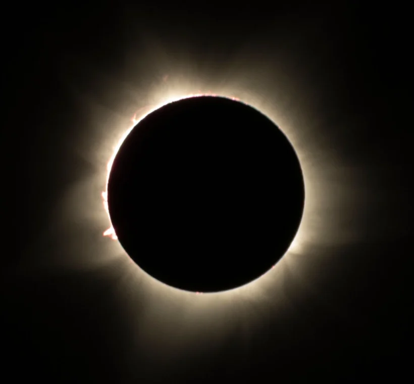 Total solar eclipse corona glowing around the darkened sun, the sight travelers seek on an Egypt Solar Eclipse Tour- Egypt Solar Eclipse Tour