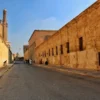 Medieval alleys of Islamic Cairo lined with ancient stone walls near a mosque