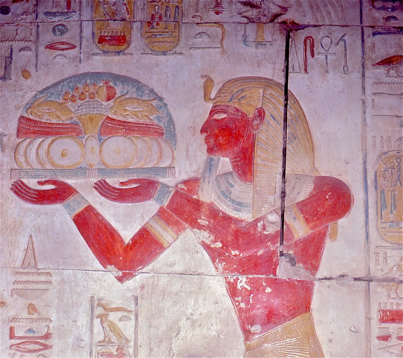 A painted relief of Seti I offering to the gods at Abydos