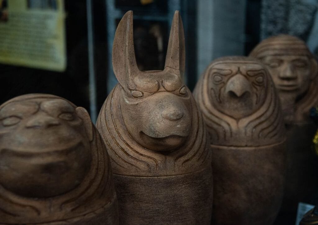 Canopic jars used alongside ancient Egyptian coffins & sarcophagi in burial rituals