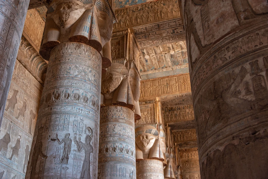Who Was the Last Pharaoh of Egypt? Ornate carved columns and hieroglyphic reliefs inside Dendera Temple, Egypt