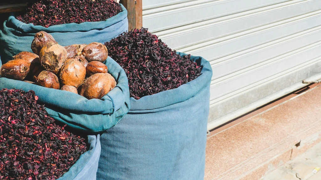 Sacks of spices and dried hibiscus at market of Khan El Khalili what to buy