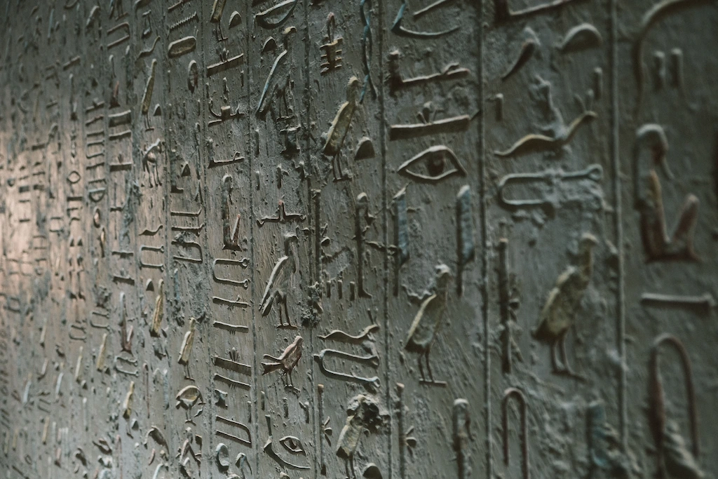 Who Was the Last Pharaoh of Egypt? Close-up of ancient Egyptian hieroglyphs carved into a temple wall in Luxor