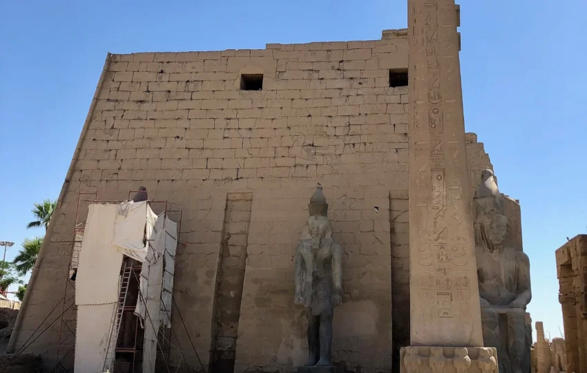 The first pylon of Luxor Temple with the seated colossi of Ramses II