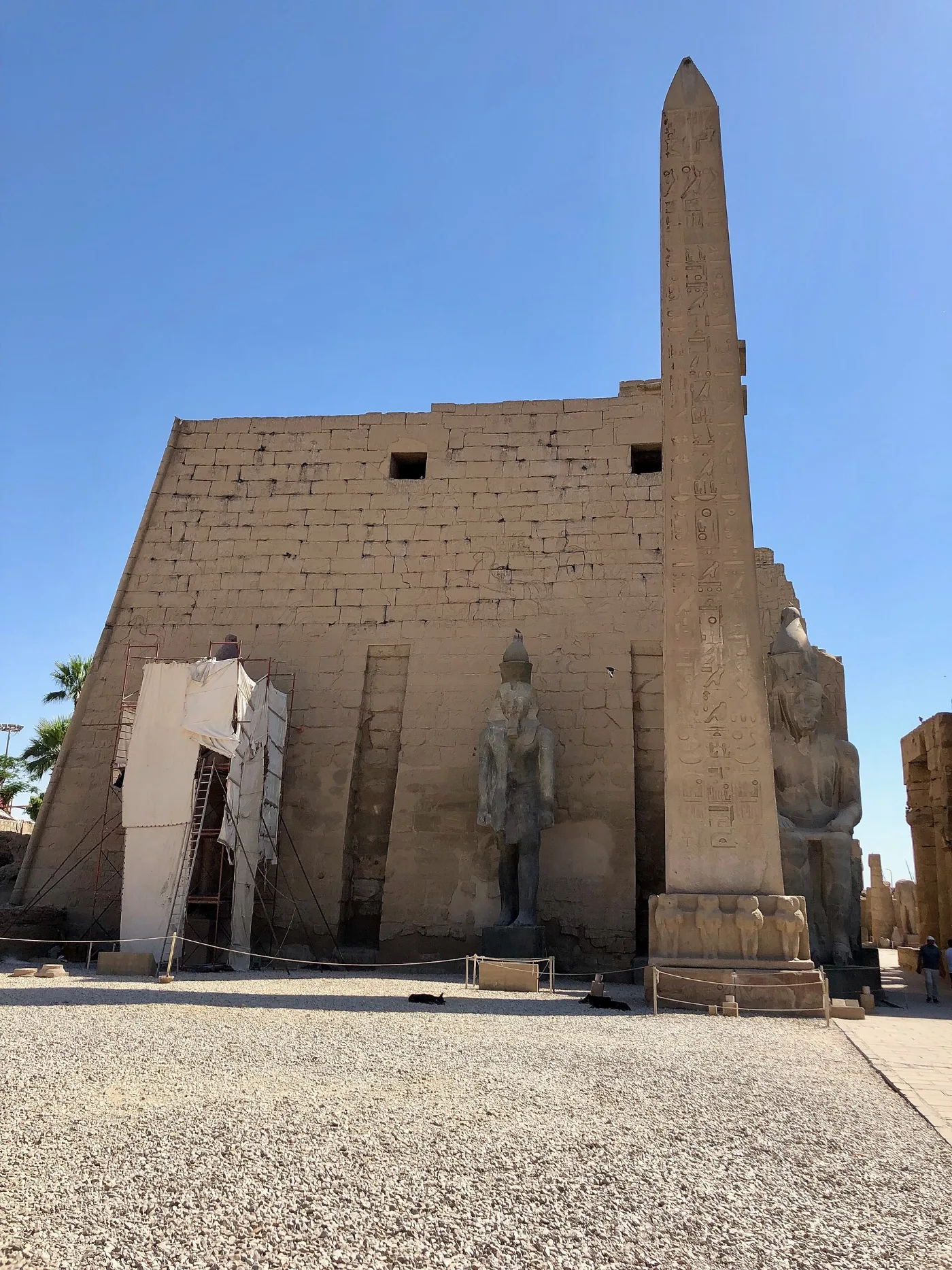 The first pylon of Luxor Temple with the seated colossi of Ramses II
