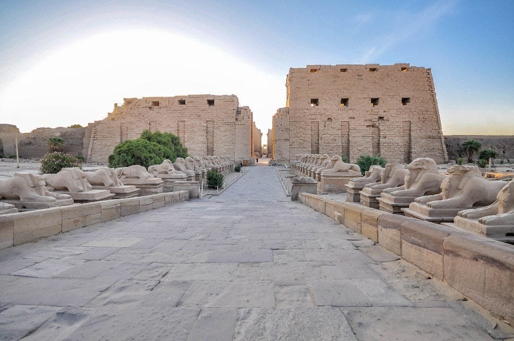 What to wear on a Nile cruise temple day - travelers walking the avenue of sphinxes at Karnak