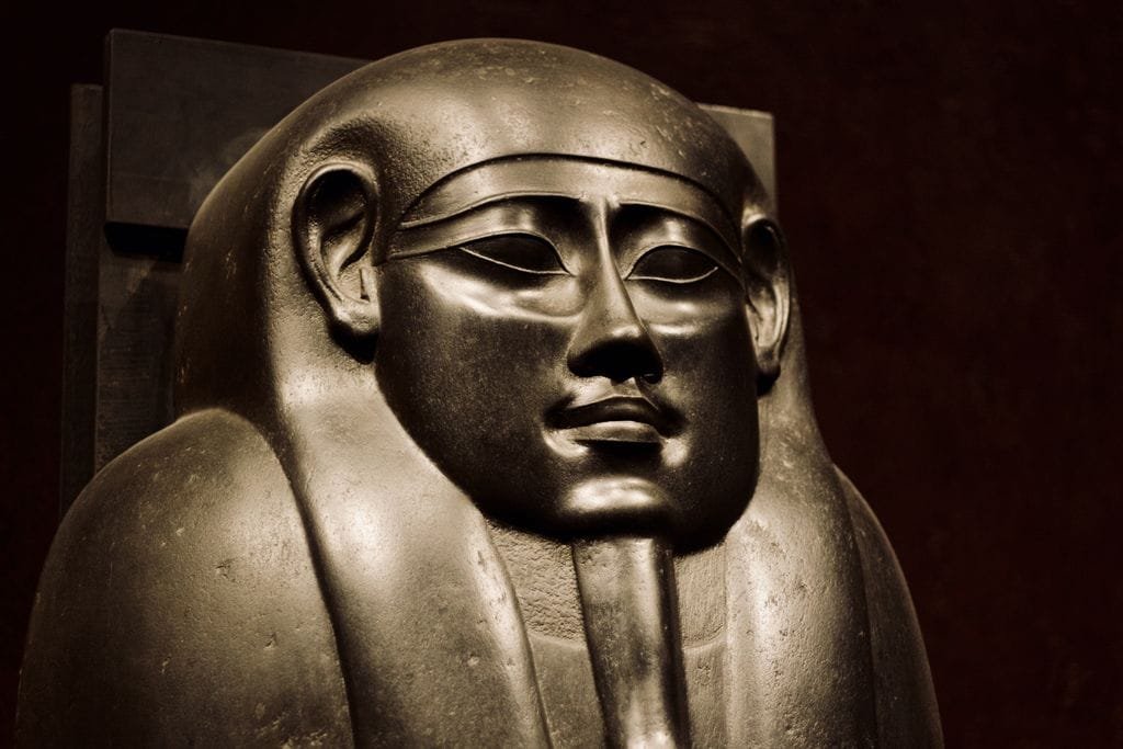 Golden pharaoh statue reflecting the archaeological legacy of the Tomb of Queen Nefertari