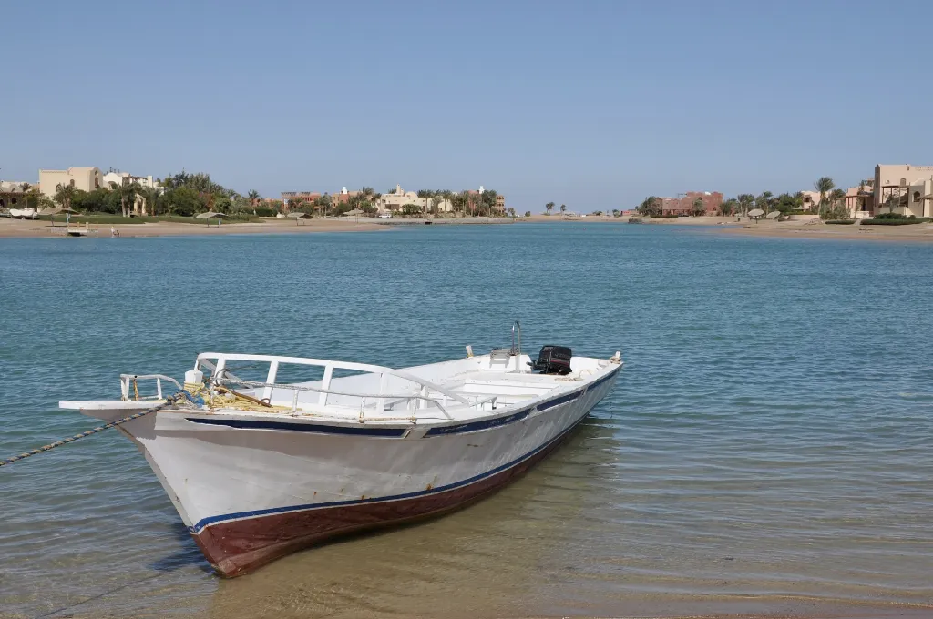 Small boat on the calm El Gouna lagoon - All Inclusive New Year Holidays