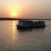 Nile cruise ship sailing into a golden sunset, one of the best Christmas river cruises between Luxor and Aswan