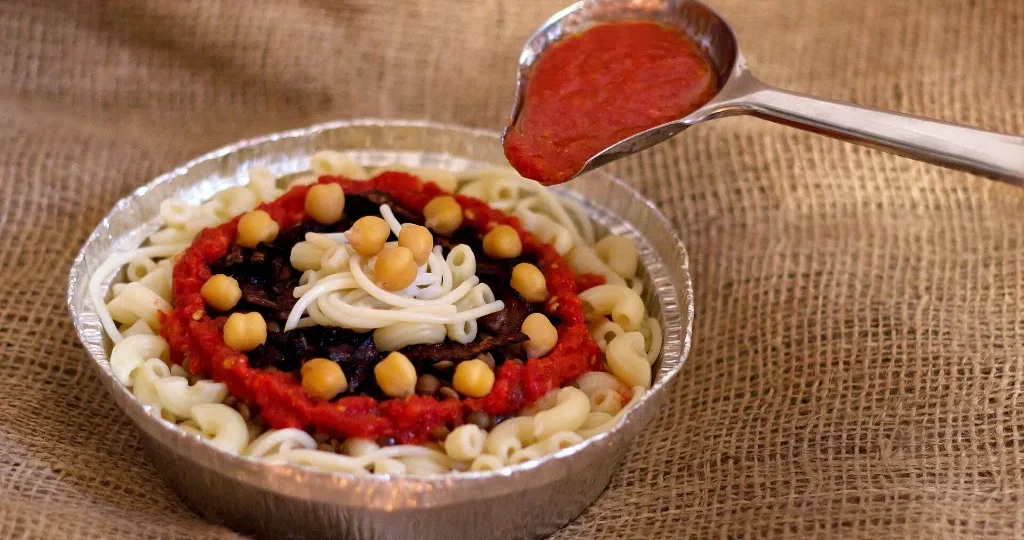 Cheap Christmas vacations in Egypt: a bowl of koshari, the classic budget meal
