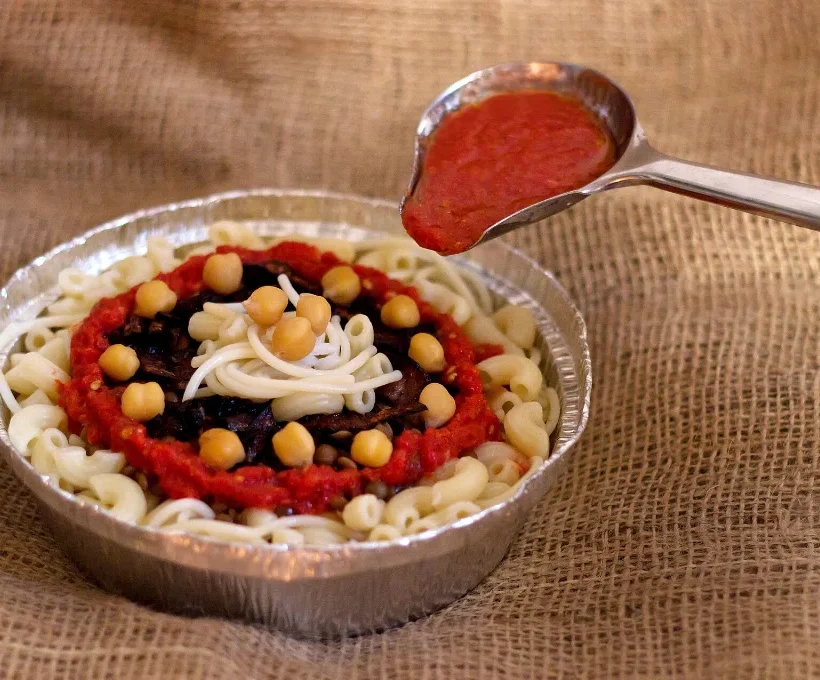 Cheap Christmas vacations in Egypt: a bowl of koshari, the classic budget meal