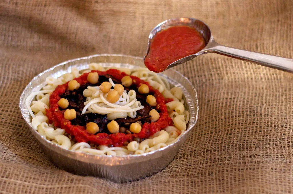 Cheap Christmas vacations in Egypt: a bowl of koshari, the classic budget meal