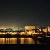 Christmas and New Year in Egypt: a floodlit Nile-side temple reflected in the water during an evening sound and light show