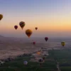 Christmas vacation ideas: hot air balloons rising over Luxor at sunrise