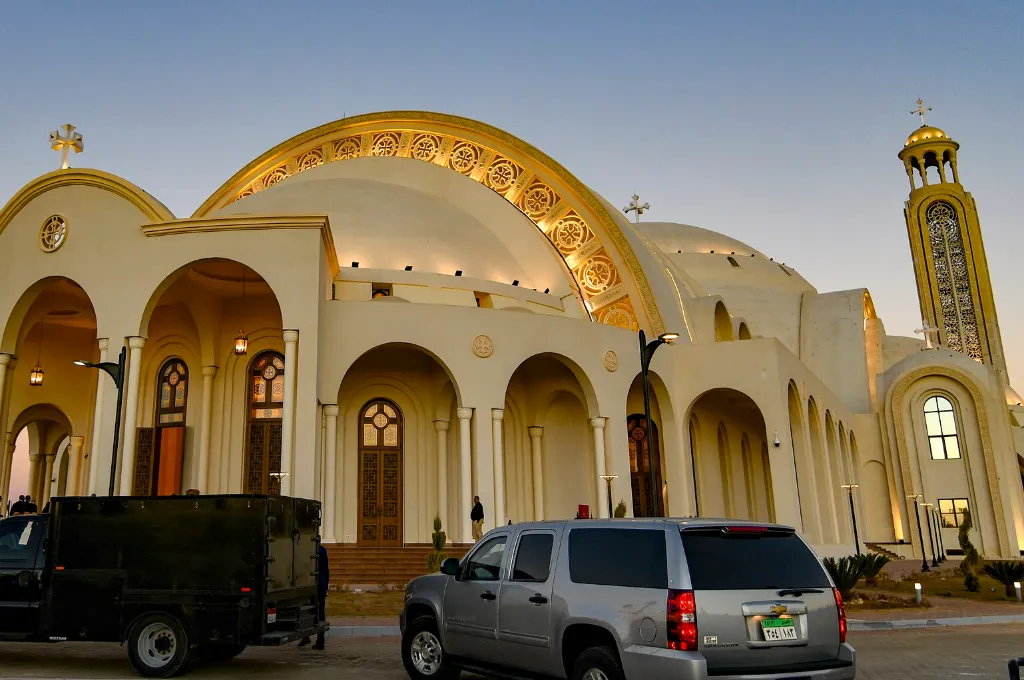Coptic Christmas in Egypt: golden domes of the Cathedral of the Nativity of Christ in Cairo at dusk