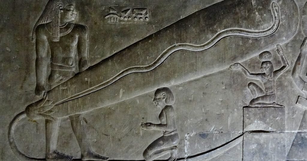 Dendera lights relief in the crypt showing a snake inside a lotus-shaped oval