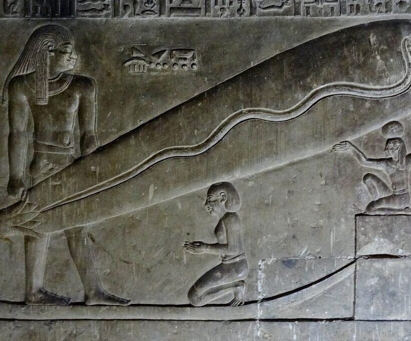 Dendera lights relief in the crypt showing a snake inside a lotus-shaped oval