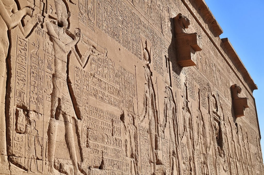 Lion-headed rain spouts on the outer wall of Dendera temple in Egypt