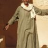 Egyptian traditional clothes: a man in an olive-green jellabiya standing in a stone doorway in Luxor