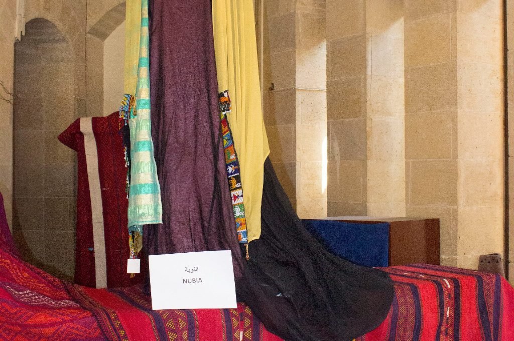 Colourful Egyptian traditional clothes and textiles hanging on display