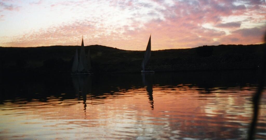 Felucca sails on the Nile at sunset, a classic felucca ride in Aswan