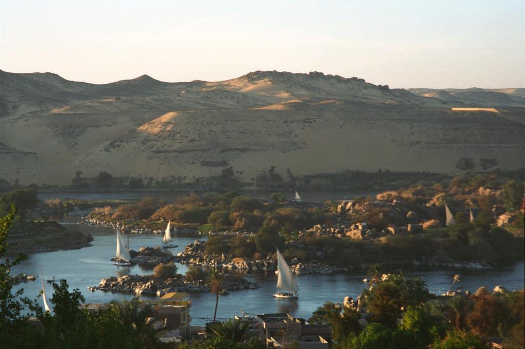 Feluccas sailing among granite rocks on the Nile on a felucca ride in Aswan