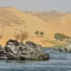 Warm Christmas vacations in Egypt: granite rocks and golden dunes along the sunlit Nile at Aswan